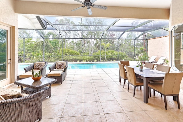 exterior space featuring glass enclosure, outdoor lounge area, a ceiling fan, and an outdoor pool