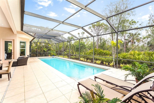 pool featuring a lanai and a patio