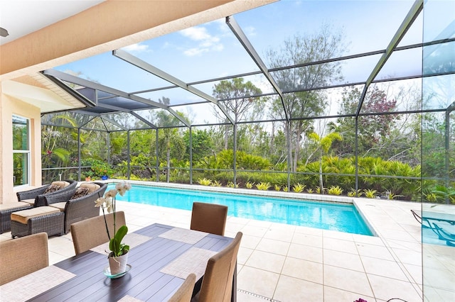 pool featuring a lanai, a patio area, and outdoor dining area