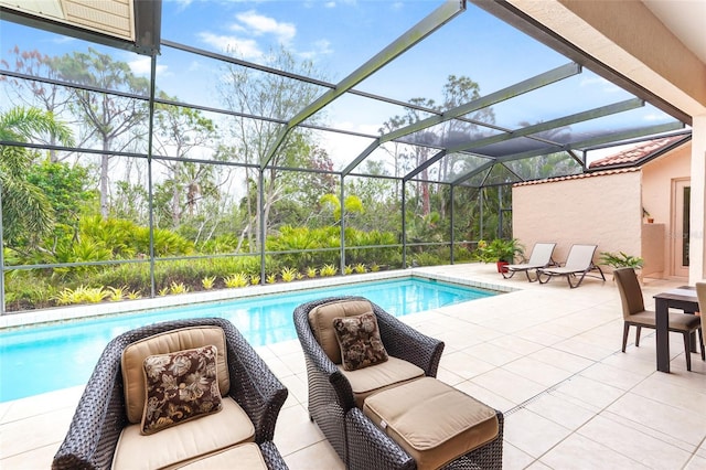 pool featuring a lanai and a patio area