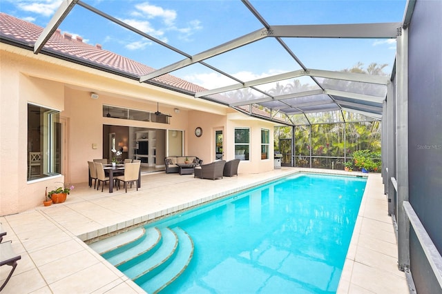 pool with glass enclosure, outdoor lounge area, and a patio