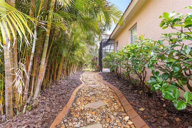 view of yard featuring a lanai