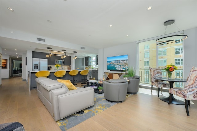 living room with light hardwood / wood-style flooring