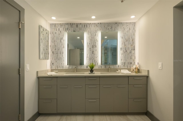 bathroom with vanity and a shower with shower door