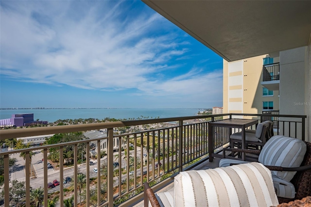 balcony featuring a water view