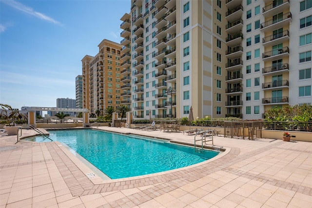 view of swimming pool with a patio