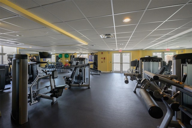 workout area with a paneled ceiling