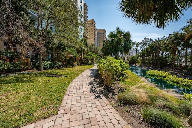 view of home's community featuring a lawn