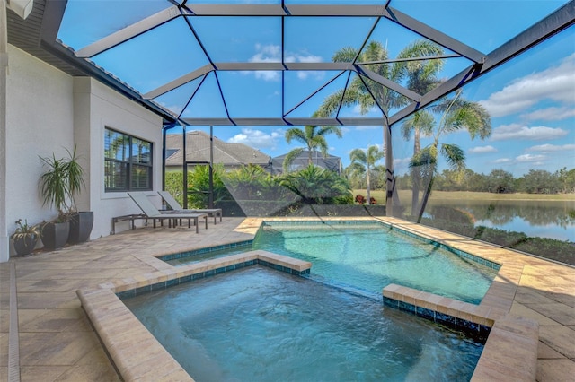 view of pool featuring a water view, a patio area, a pool with connected hot tub, and a lanai