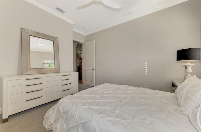 bedroom featuring a ceiling fan, light carpet, crown molding, and visible vents