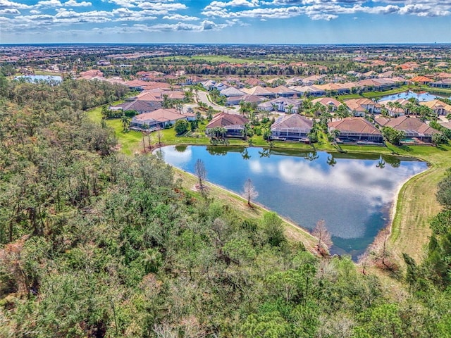 bird's eye view featuring a water view and a residential view