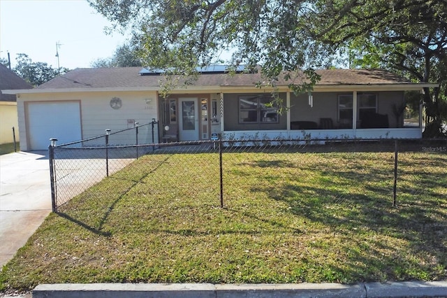 ranch-style house with a garage, a sunroom, and a front yard