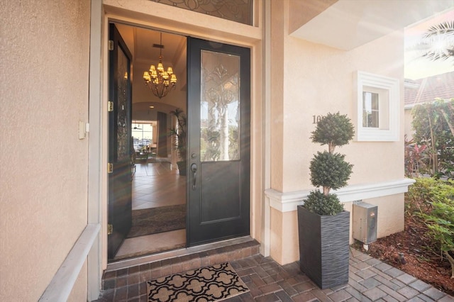 doorway to property with stucco siding