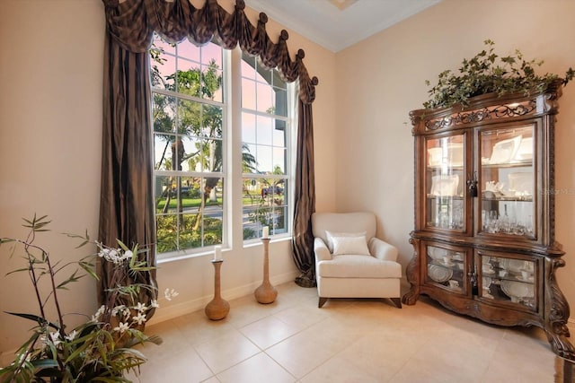 sitting room with light tile patterned floors and baseboards