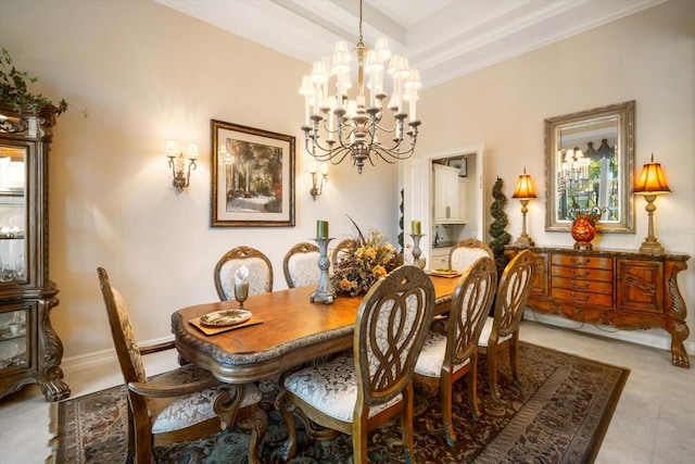 dining space with a tray ceiling, a notable chandelier, light tile patterned floors, ornamental molding, and baseboards