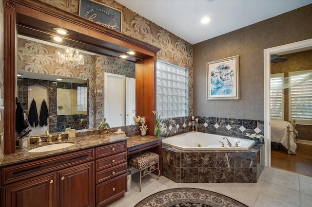 bathroom with a garden tub, tile patterned floors, connected bathroom, vanity, and wallpapered walls