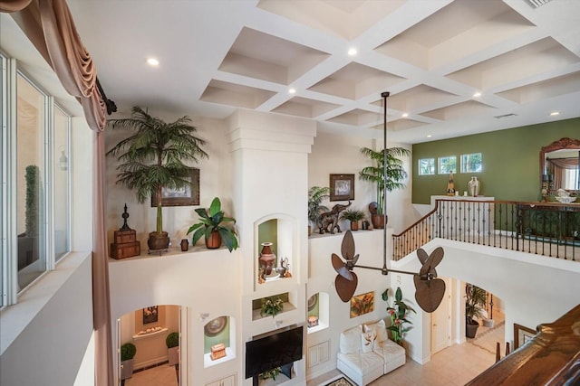 hallway with recessed lighting, beam ceiling, and coffered ceiling