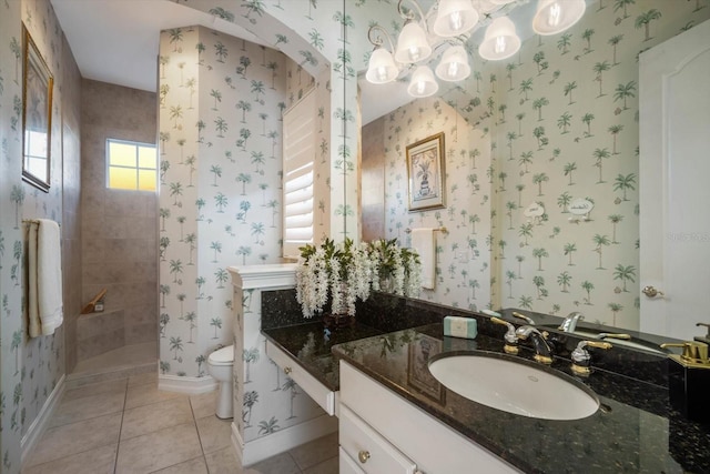 bathroom with wallpapered walls, baseboards, tiled shower, toilet, and tile patterned flooring