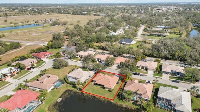 drone / aerial view with a water view