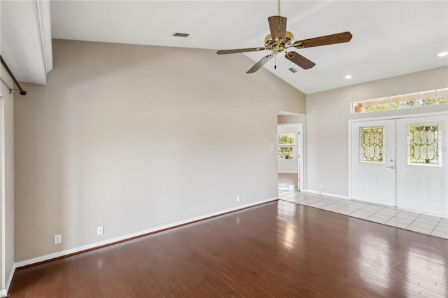 spare room featuring french doors, ceiling fan, high vaulted ceiling, and light hardwood / wood-style flooring