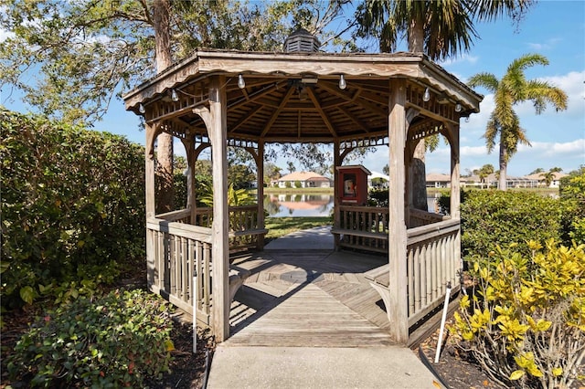 surrounding community featuring a water view and a gazebo