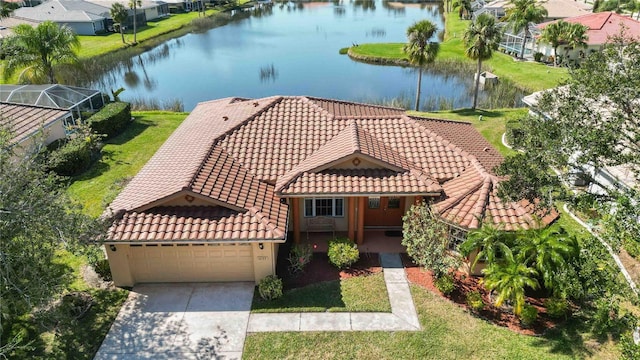 birds eye view of property with a water view