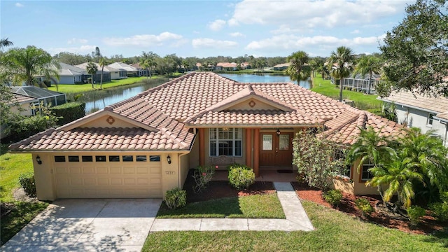 view of front facade featuring a water view and a garage