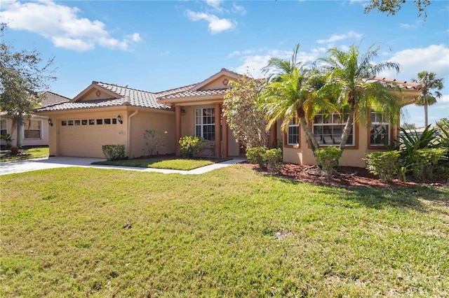 view of front of property featuring a garage and a front yard