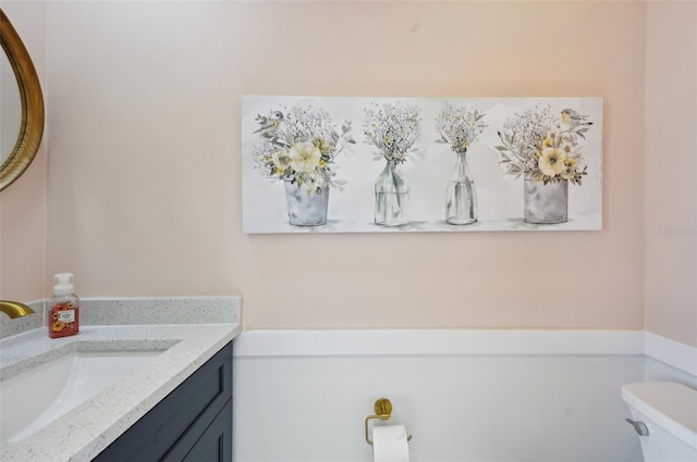 bathroom with vanity and toilet