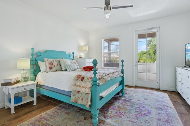 bedroom featuring dark wood-type flooring, access to exterior, and ceiling fan