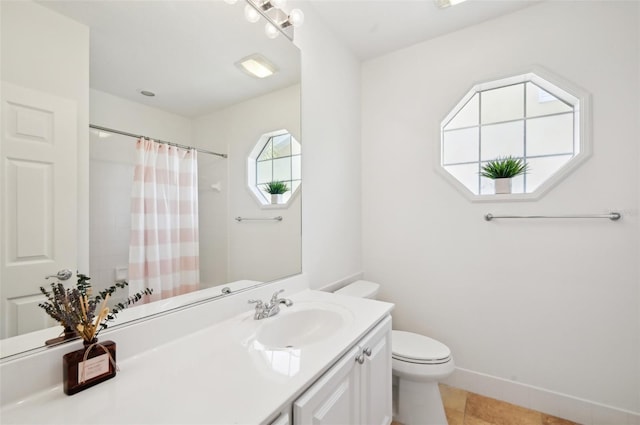 bathroom featuring tile patterned floors, vanity, toilet, and curtained shower