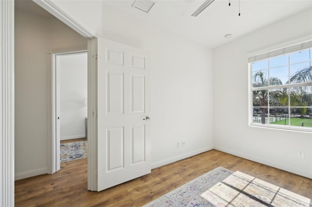 unfurnished bedroom featuring hardwood / wood-style floors