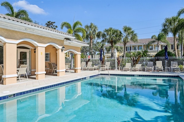 view of swimming pool featuring a patio area