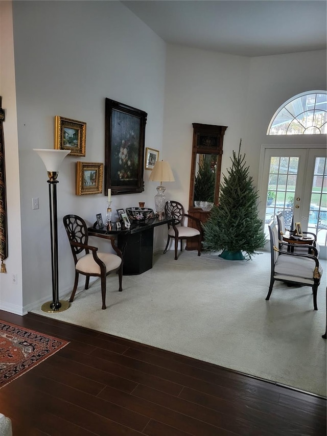 living room with hardwood / wood-style flooring and french doors