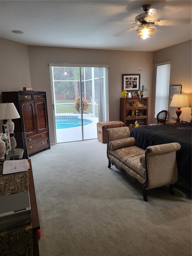 carpeted bedroom with access to outside and ceiling fan