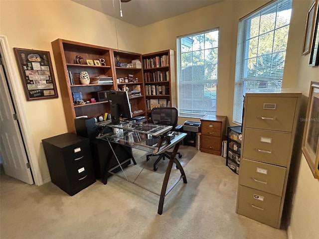 office area with light colored carpet and ceiling fan