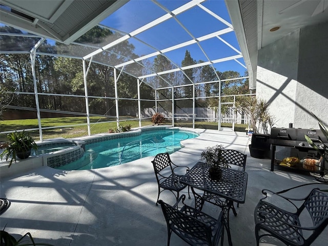 view of pool featuring an in ground hot tub, area for grilling, a lanai, and a patio area