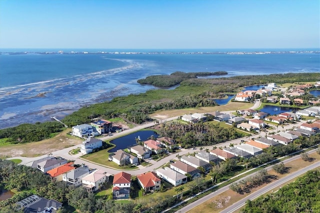 drone / aerial view featuring a water view and a residential view