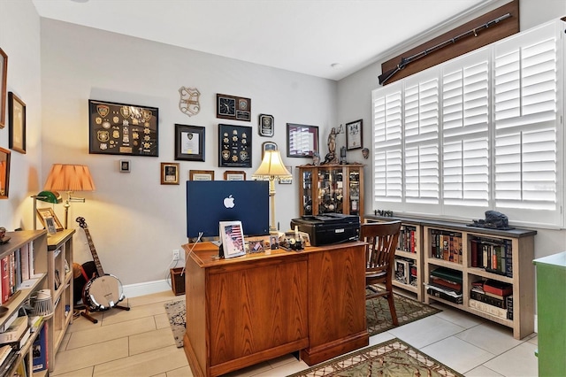 office featuring baseboards and tile patterned flooring