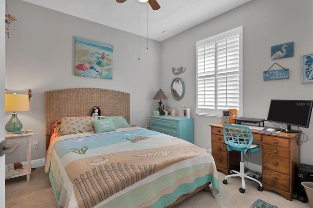 carpeted bedroom with baseboards and a ceiling fan