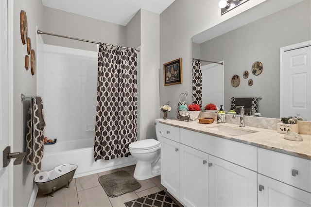 bathroom featuring tile patterned flooring, toilet, vanity, and shower / bath combo