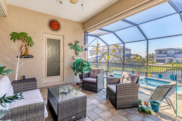 view of patio / terrace with an outdoor living space, a fenced in pool, ceiling fan, a lanai, and a residential view