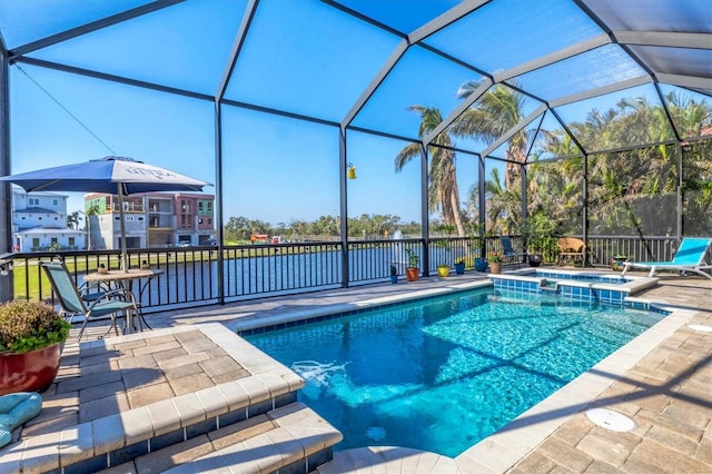 view of swimming pool with a patio, a lanai, and a pool with connected hot tub