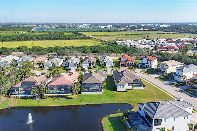 aerial view featuring a residential view and a water view