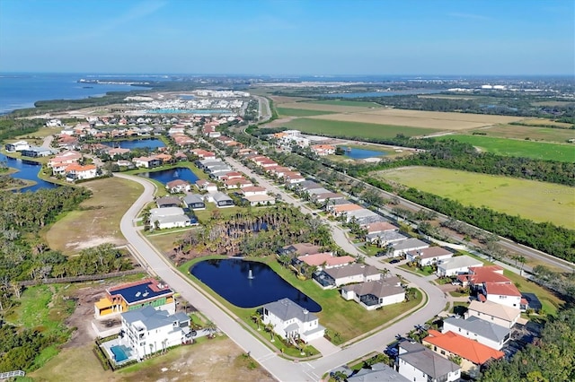 birds eye view of property with a residential view and a water view