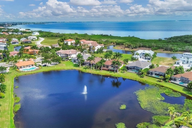 bird's eye view featuring a residential view and a water view