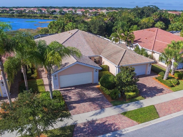 birds eye view of property featuring a water view