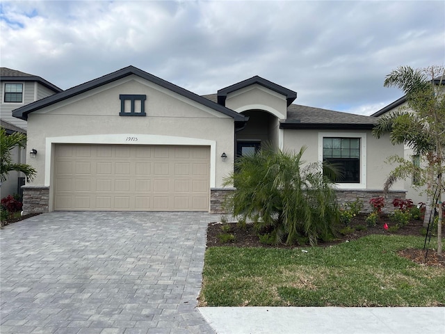 view of front facade with a garage and a front yard