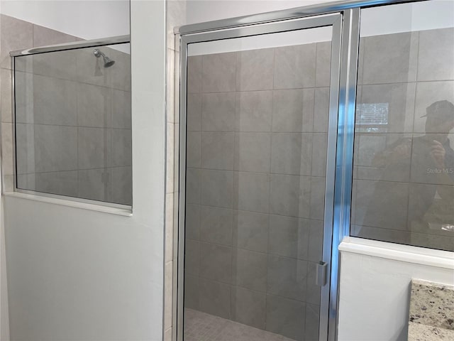 bathroom featuring an enclosed shower