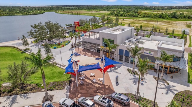 birds eye view of property with a water view